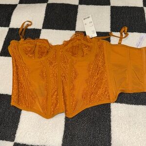 Out from under Urban outfitter corset top.